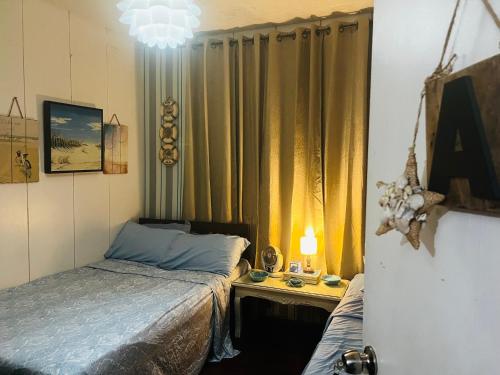 Ένα ή περισσότερα κρεβάτια σε δωμάτιο στο Anton & Isabel Charming Home in Bangued