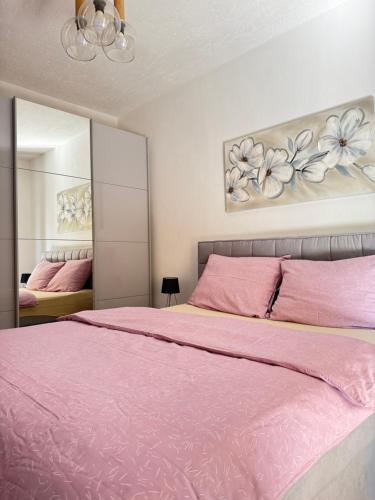 Posteľ alebo postele v izbe v ubytovaní Apartman ANA