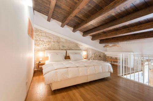 Postel nebo postele na pokoji v ubytování Hotel Villa Carlotta