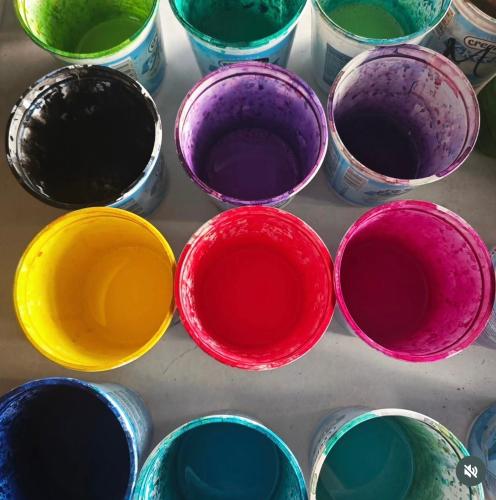 a group of different colored bowls on a table at LE FARE BLEU Tiputa Rangiroa in Tiputa