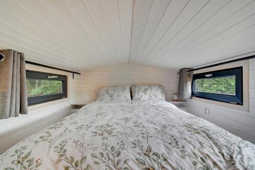 Ένα ή περισσότερα κρεβάτια σε δωμάτιο στο Tiny house face à la forêt - Évasion nature
