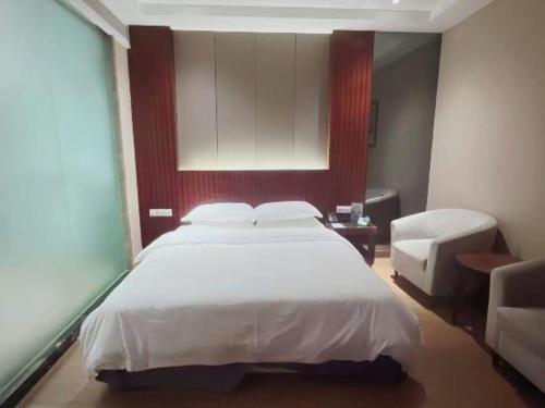 Katil atau katil-katil dalam bilik di Santavan Hotel Shenzhen Guangming