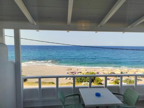 a view of the beach from a house balcony at villa vagelis in Mourteri