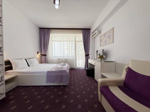 Un pat sau paturi într-o cameră la Resort Leon Beach