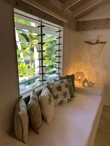 Rúm í herbergi á Coco Bay Villa - Luxury in Simplicity