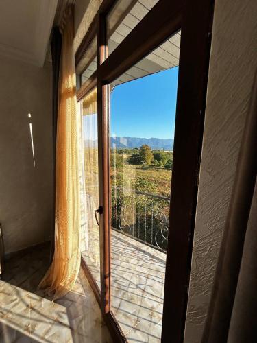 an open door to a balcony with a view at Hotel Zhara in K'obulet'i