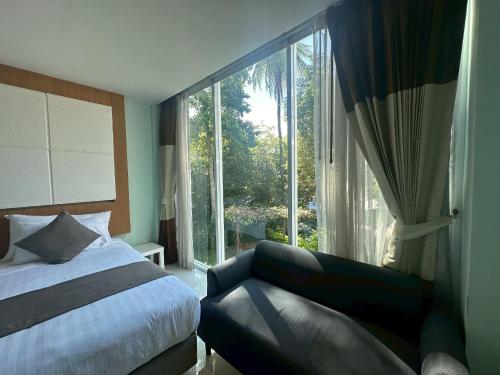 Postel nebo postele na pokoji v ubytování A Hotel Simply