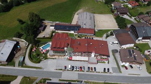 an overhead view of a town with buildings and a street at Hotel Der Wastlhof - Pools, Spa & eigene Reitschule in Niederau
