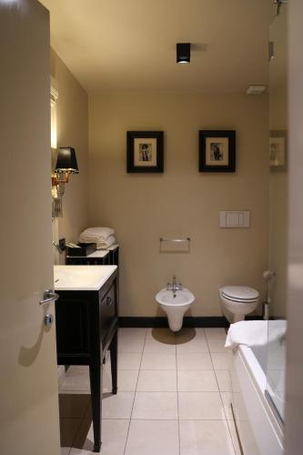a bathroom with a sink and a toilet at Santa Maria Foris in Ravenna