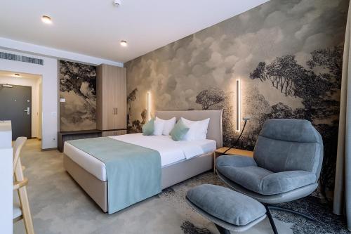 Postel nebo postele na pokoji v ubytování ARIS Boutique Hotel & SPA