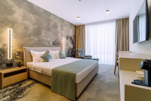 Postel nebo postele na pokoji v ubytování ARIS Boutique Hotel & SPA