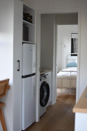a kitchen with a washer and dryer in a room at Milfarrago Farm Stay in Farnborough