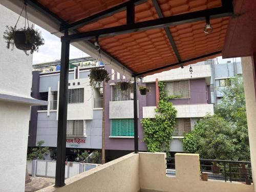 a view of a building from the balcony of a building at Tranquil Trails-Nashik in Nashik