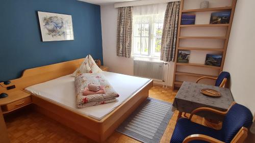 a bedroom with a bed with a teddy bear on it at Ulli 1 in Zell am See