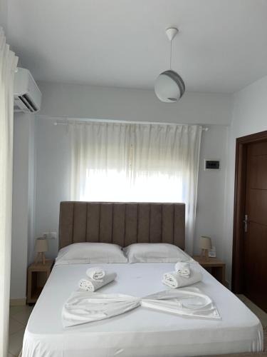 Ein Bett oder Betten in einem Zimmer der Unterkunft Helios Rooms