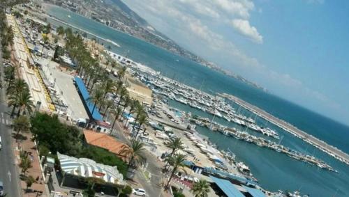 a view of a beach with a bunch of boats at Casa Biznaga in Santa Fe de los Boliches