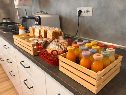 a kitchen counter with jars of oranges on it at L'arancio B&B in Cecchina