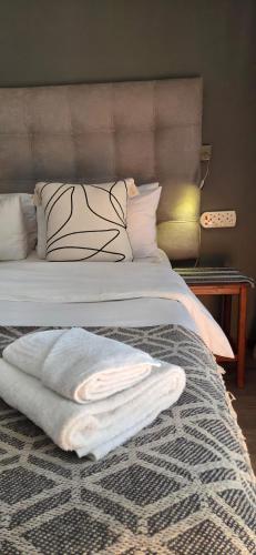 Ένα ή περισσότερα κρεβάτια σε δωμάτιο στο Bo Kamer Guesthouse