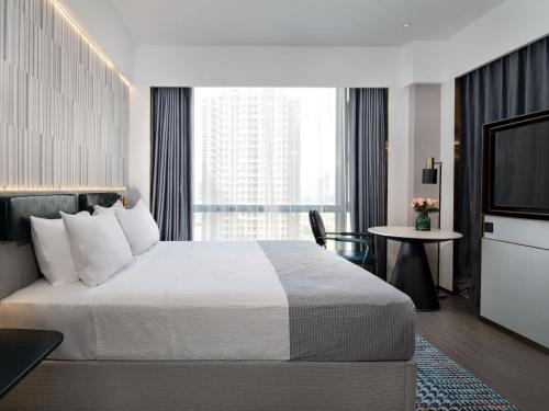 Postel nebo postele na pokoji v ubytování Huizhou Zhongkai Hi-Tech Zone Meihua Hotel