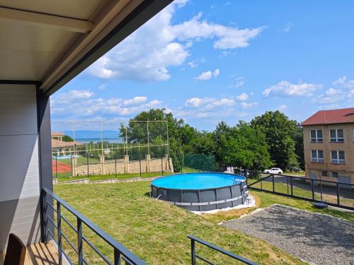 a view of a swimming pool from a balcony at Chatka Katka in Klokočov