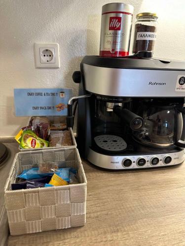 a coffee maker sitting on top of a counter at Tinos dream sea ,150m from the beach in Agios Sostis