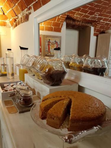 a table with a piece of cake on a plate at Cascina Spazio Indaco in Castagnole Monferrato