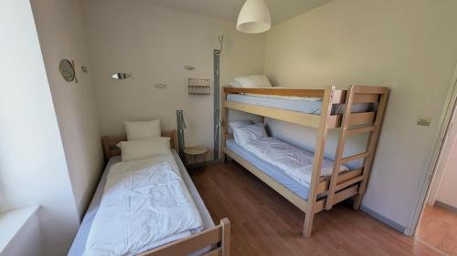 Katil atau katil-katil dalam bilik di Grand Gîte La Buissonnière