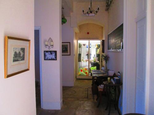 a hallway with a living room and a dining room at Weston Manor in Freshwater