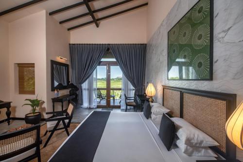 Postel nebo postele na pokoji v ubytování Ceylon Breeze Sigiriya