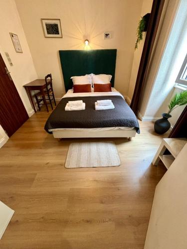 a bedroom with a large bed in a room at Escapade Saint Michel in Pontorson