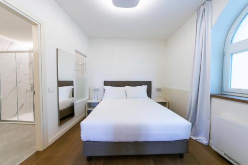 Postel nebo postele na pokoji v ubytování Arona Palace