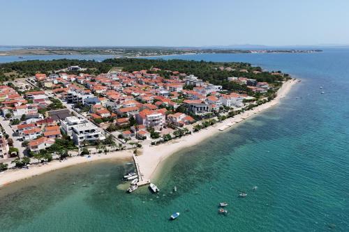 an aerial view of a beach with boats in the water at K2-Penthouse with sea view and heated pool in Vir