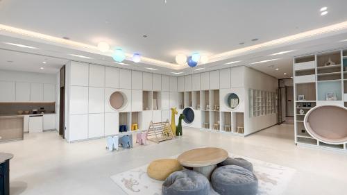 a large room with a table and some bowls on the floor at SkyHigh 2BR Burj Views Steps to Dubai Mall in Dubai