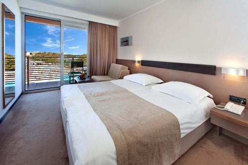 Ένα ή περισσότερα κρεβάτια σε δωμάτιο στο Apartments Maricela dvije spavace