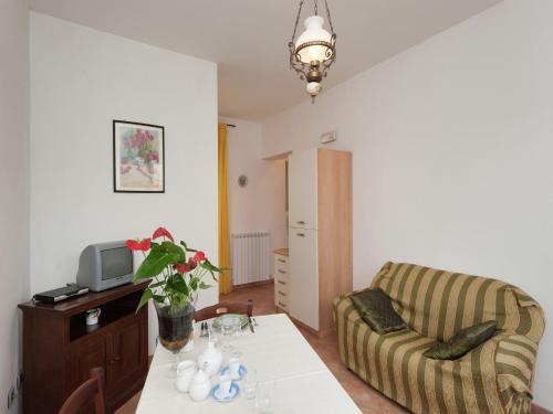 a living room with a couch and a table at Stunning Farmhouse in Passignano with Pool in Passignano sul Trasimeno