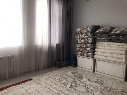 Postel nebo postele na pokoji v ubytování Tuzdybastau Guest House