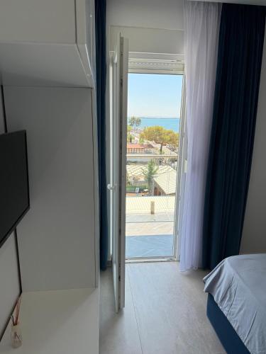 Ένα ή περισσότερα κρεβάτια σε δωμάτιο στο Sea La Vie