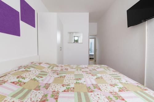 Ένα ή περισσότερα κρεβάτια σε δωμάτιο στο Apartments Dobronic