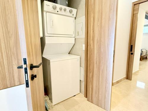 a white washer and dryer in a room at Beachfront family friendly 1 bdr NT505 in Puerto Vallarta