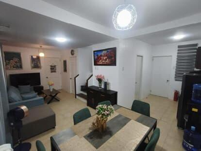 a living room with a table and a couch at Not Avail in Dao