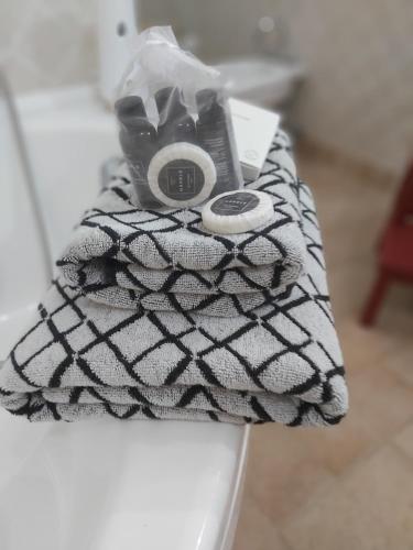 a black and white blanket with a camera on it at La Bandiera Blu in La Spezia