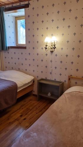 two beds in a room with stars on the wall at Gite de Folgoux in Malvières