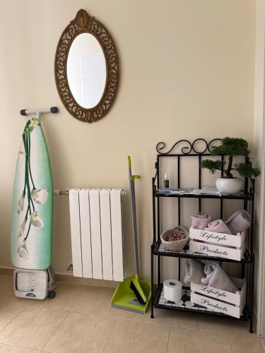 a room with a shelf with a mirror and a surfboard at Apartments Villa Dinka in Hvar