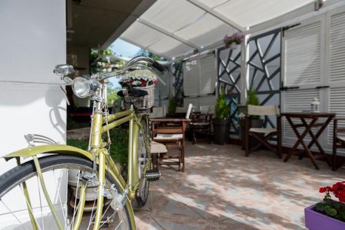 a yellow bike parked next to a patio at Electra Apartments & Studios 2 in Keramotí