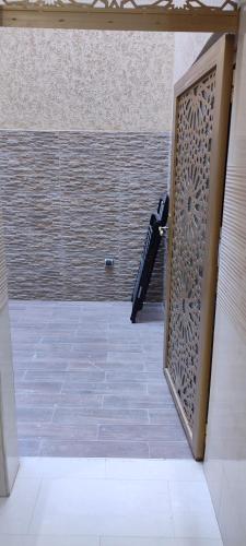 a room with a shower with a glass door at Dar lala soukaina in Marrakesh