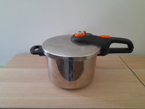 a knife on top of a pot on a table at Authenticity Preserved in Brionne