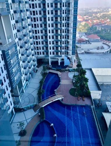 an overhead view of a swimming pool in a building at Anderson pakuwon 2 Bedroom 6 people stay in Surabaya