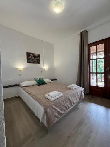 Postel nebo postele na pokoji v ubytování Hotel Paradise Ouranoupolis