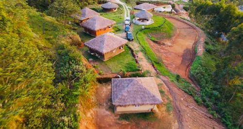 an aerial view of a group of houses with roofs at FOOD FOREST KANTHALLOOR in Kanthalloor