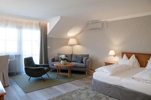 Una cama o camas en una habitación de Hotel Hanswirt